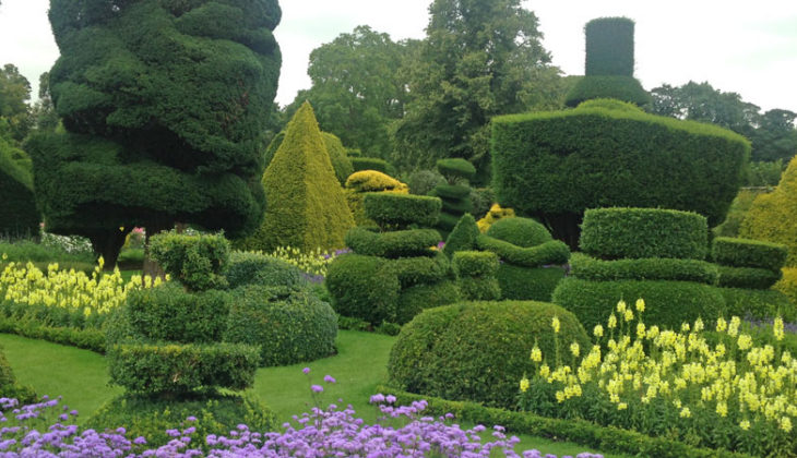 The extravagant topiary shapes outside the Elizabethan house